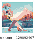 Girl in Downward Dog yoga pose near mountain lake 129092407