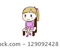 (Full-body oblique view) A Caucasian girl sitting on a chair with her legs crossed and smiling 129092428