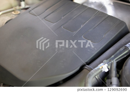 Rat footprint in the car engine 129092690