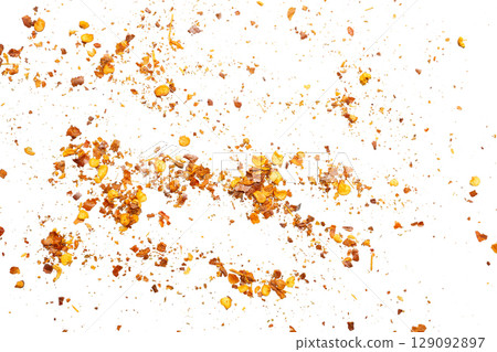 dried red chili pepper flakes and seeds isolated on white background 129092897