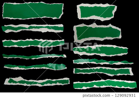 piece of green paper tear set isolated on black background 129092931