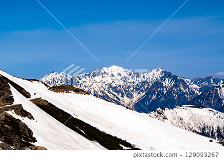 Mount Okuhotaka in the Hotaka mountain range seen from the Norikura snowfield. Climbing Mount Norikura in the Northern Alps during Golden Week when snow remains. Mount Okuhotaka in the Hotaka mountain range seen from the Norikura snowfield. Climbing Mount Norikura in the Northern Alps during Golden Week when snow remains. 129093267