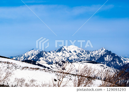 View of Okuhotakadake and Maehotakadake from Igahara on Mt. Norikura. Climbing Mt. Norikura in the Northern Alps during Golden Week when snow remains. View of Okuhotakadake and Maehotakadake from Igahara on Mt. Norikura. Climbing Mt. Norikura in the Northern Alps during Golden Week when snow remains. 129093293