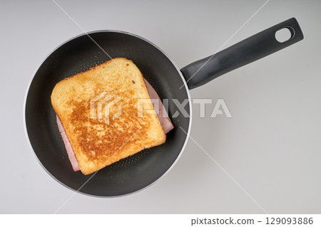 Crusty croque-monsieur on pan Crusty croque-monsieur on pan 129093886