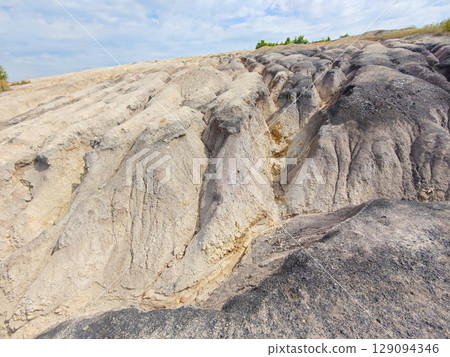 Tailings and waste sand in mined open pit coal quarry. Heavy erosion Tailings and waste sand in mined open pit coal quarry. Heavy erosion 129094346