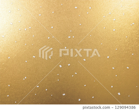 Silver confetti on a gold background 129094386
