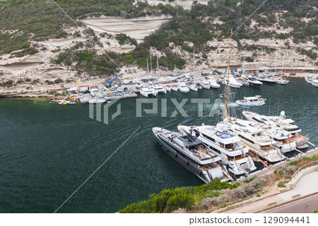 Luxury Yachts and Boats Docked in a Picturesque Marina of Bonifacio, Corsica Luxury Yachts and Boats Docked in a Picturesque Marina of Bonifacio, Corsica 129094441