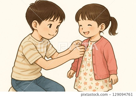 An older brother helps his younger sister get dressed 129094761