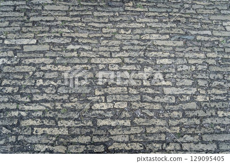 Red grunge brick wall, abstract background texture with old dirty and vintage style pattern Red grunge brick wall, abstract background texture with old dirty and vintage style pattern 129095405