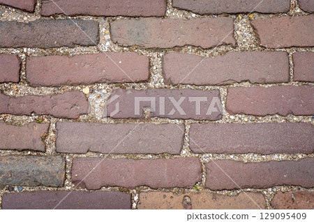 Red grunge brick wall, abstract background texture with old dirty and vintage style pattern Red grunge brick wall, abstract background texture with old dirty and vintage style pattern 129095409