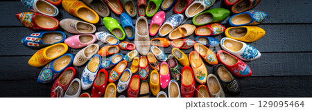 Clogs for sale at a Dutch retail shop. Wooden shoes are a well know traditional souvenir from Holland 129095464