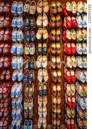 Set of different colorful vintage Dutch wooden clogs Set of different colorful vintage Dutch wooden clogs 129095488