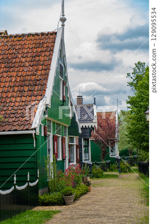 Authentic Zaandam mills on the water channel in Zaanse Schans willage. Zaanse Schans Windmills and famous Netherlands canals, Europe. 129095534
