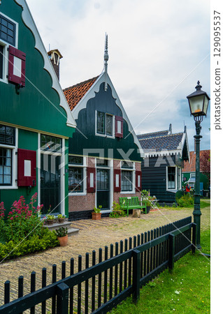 Authentic Zaandam mills on the water channel in Zaanse Schans willage. Zaanse Schans Windmills and famous Netherlands canals, Europe. 129095537