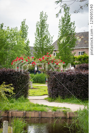 Authentic Zaandam mills on the water channel in Zaanse Schans willage. Zaanse Schans Windmills and famous Netherlands canals, Europe. 129095540