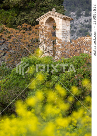 parish church Sant Miquel, chapel from the 13th century, near Campanet in front of the Tramuntana mountains, Mallorca, Balearic Islands, Spain, Europe 129095618