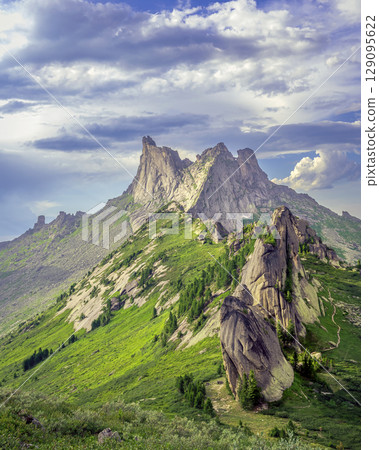 Mountain peak under the dramatic sky Mountain peak under the dramatic sky 129095622