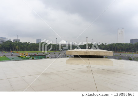 Jakarta, Indonesia - Mar 31,2024 : Cityscape and Merdeka Square in Jakarta, Indonesia on Mar 31,2024. Jakarta, Indonesia - Mar 31,2024 : Cityscape and Merdeka Square in Jakarta, Indonesia on Mar 31,2024. 129095665
