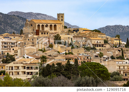 The village of Selva is located on a hill in front of the Serra de Tramuntana mountains, Majorca, Mallorca, Balearic Islands, Spain, Europe The village of Selva is located on a hill in front of the Serra de Tramuntana mountains, Majorca, Mallorca, Balearic Islands, Spain, Europe 129095716