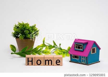 The word "home" and a miniature house model The word "home" and a miniature house model 129095801