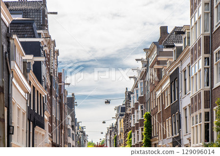 Details and facades of Amsterdam characteristic brick construction of residential building in Amsterdam School style. High quality photo Details and facades of Amsterdam characteristic brick construction of residential building in Amsterdam School style. High quality photo 129096014