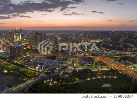 Cincinnati Ohio urban architecture in city downtown at night. Panoramic view of business district skyline with high-rise buildings at nightfall Cincinnati Ohio urban architecture in city downtown at night. Panoramic view of business district skyline with high-rise buildings at nightfall 129096204