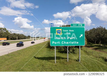 American freeway exit sign in Florida. I-75 highway junction with direction to North Port and Port Charlotte 129096325