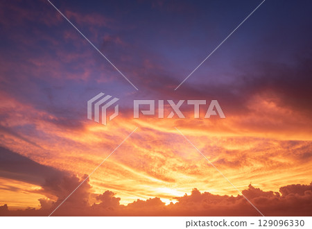 Amazing evening skyscape. Sunset sky with bright colorful clouds Amazing evening skyscape. Sunset sky with bright colorful clouds 129096330