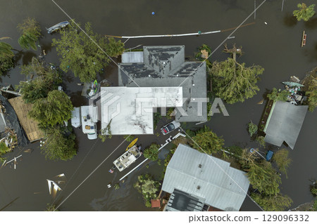 Aftermath of natural disaster. Flooded houses by hurricane Ian rainfall in Florida residential area Aftermath of natural disaster. Flooded houses by hurricane Ian rainfall in Florida residential area 129096332