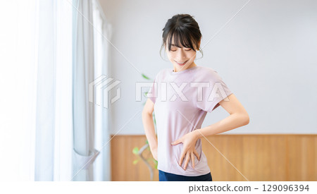 A woman checking her body line 129096394