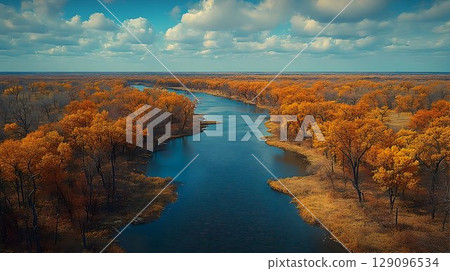 Aerial view river landscape blue water flowing through warm earth tones 129096534