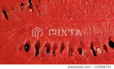 Close-up of ripe fresh sweet juicy watermelon, natural food background Close-up of ripe fresh sweet juicy watermelon, natural food background 129096791