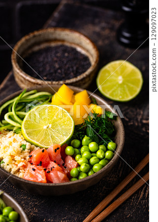 Healthy bowl with salmon and vegetables 129097023