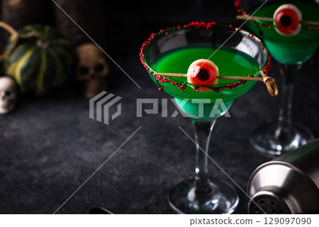 Spooky green halloween cocktail with eyeballs Spooky green halloween cocktail with eyeballs 129097090