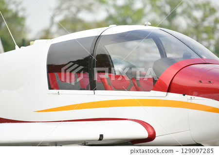 Mini white airplane at the airfield 129097285
