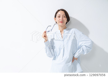 A woman with glasses A woman with glasses 129097856