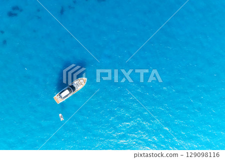 Summertime vacation. Drone view on the yacht. Sail yacht on the sea as a background. 129098116