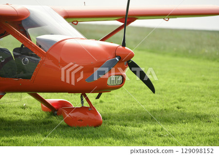 The red gyrocopter at the airfield 129098152