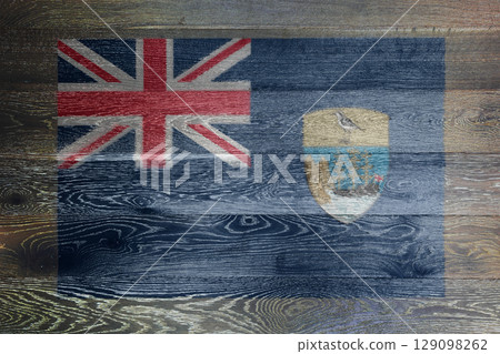 Saint Helena flag on rustic old wood surface background 129098262
