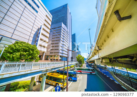 Yokohama cityscape in Japan: In front of Yokohama Station. View of the East Exit rotary and the ETC entrance for the Metropolitan Expressway. Yokohama cityscape in Japan: In front of Yokohama Station. View of the East Exit rotary and the ETC entrance for the Metropolitan Expressway. 129098377