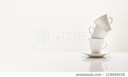 Three white porcelain coffee cups on a white table with reflection. Coffee white composition with copy space. Vertical format, soft focus Three white porcelain coffee cups on a white table with reflection. Coffee white composition with copy space. Vertical format, soft focus 129098456