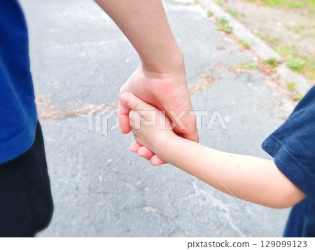 help friend through a tough time. rescue gesture. support, friendship and salvation concept. holding hands. Holding hands together help friend through a tough time. rescue gesture. support, friendship and salvation concept. holding hands. Holding hands together 129099123