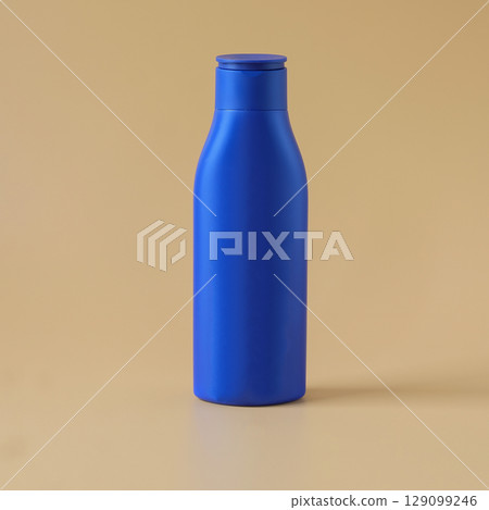 blue plastic bottle on color background. 129099246