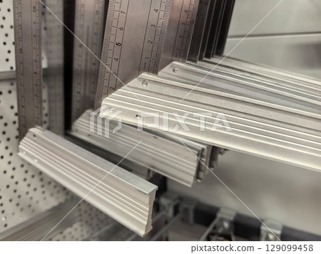 Metal rulers in a hardware store display for construction and design 129099458