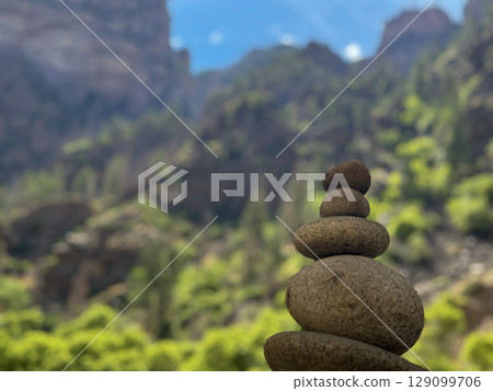 Balanced Rock Cairn in Mountain Canyon Landscape Balanced Rock Cairn in Mountain Canyon Landscape 129099706