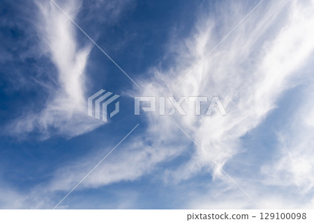 Beautiful blue sky with a white clouds 129100098
