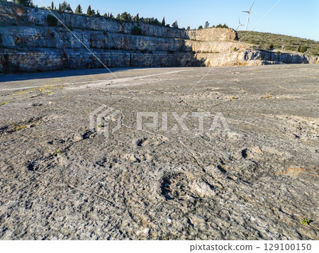 Natural monument of fossil dinosaur footprints in Portugal. Pedagogical circuit and visitors can see and touch the footprints 129100150