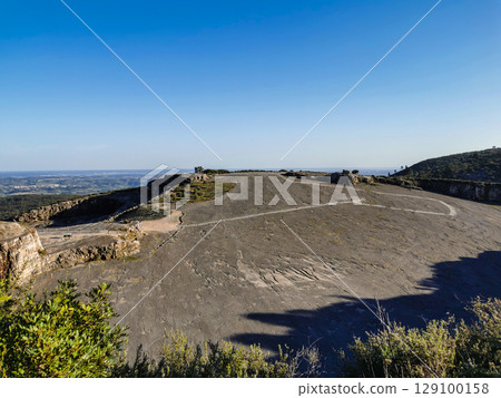 Natural monument of fossil dinosaur footprints in Portugal. Pedagogical circuit and visitors can see and touch the footprints 129100158
