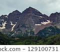 Maroon Bells Peaks in Summer with Snow Patches and Lush Forest 129100731