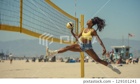 Athletic woman performing midair split near volleyball net, demonstrating dynamic competition under bright sunlight 129101241